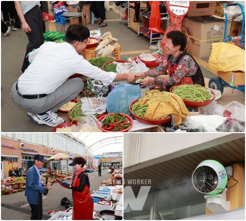 김철우 보성군수가 벌교 전통시장을 방문해 쿨링포그(Cooling Fog) 시스템을 확인하고 인사를 나누고 있다